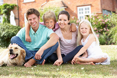 a group of people sitting around a dog